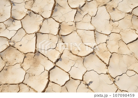 Cracked dry clay soil texture or background. Effects of climate change, desertification and droughts 107098459