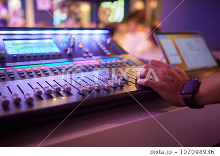 Sound mixer. Professional audio mixing console with lights, buttons, faders and sliders. Sound mixer. Professional audio mixing console with lights, buttons, faders and sliders. 107098936