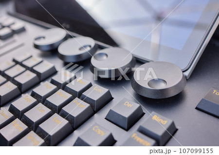 Man hands of sound engineer adjusting audio mixing console. 107099155