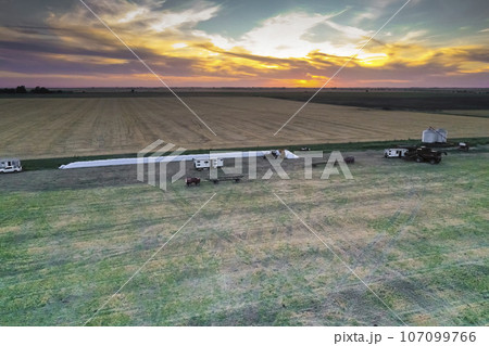 Silo bag work in pampas countryside, grain storage in La Pampa, Argentina Silo bag work in pampas countryside, grain storage in La Pampa, Argentina 107099766