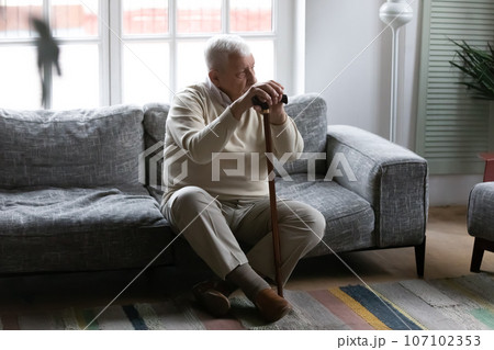 Sad elderly disabled man feel lonely at home Sad elderly disabled man feel lonely at home 107102353