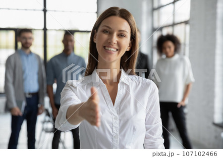Caucasian businesswoman stretch hand greeting new employee 107102466