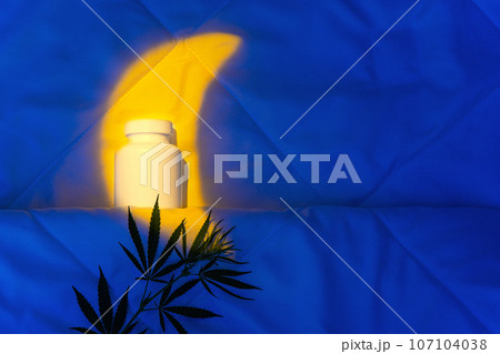 Evening bedroom with jar of capsules, cannabidiol gummies, cannabis branch Evening bedroom with jar of capsules, cannabidiol gummies, cannabis branch 107104038