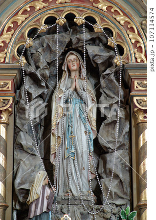 Our Lady of Lourdes statue on the altar in Parish Church of Saint Roch in Kratecko, Croatia Our Lady of Lourdes statue on the altar in Parish Church of Saint Roch in Kratecko, Croatia 107114574