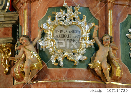 Angels, statue on the pulpit in the Parish Church of the Holy Cross in Zacretje, Croatia 107114729