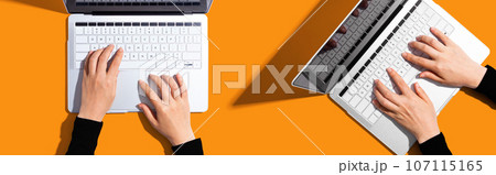 Two people working together with laptop Two people working together with laptop 107115165