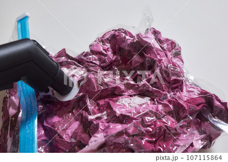 Space saver saving seal bag sucking air vacuum clothing storage compressed package. Space saver saving seal bag sucking air vacuum clothing storage compressed package. 107115864