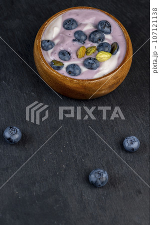 fresh purple and white yogurt with blueberries and blueberry berry flavor fresh purple and white yogurt with blueberries and blueberry berry flavor 107121138