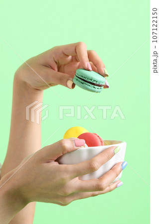 Hand with Macaroons 107122150