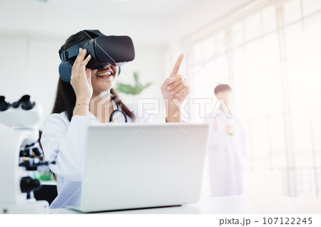 Student using VR glasses headset technology for help visual learning education science class room in modern school Student using VR glasses headset technology for help visual learning education science class room in modern school 107122245