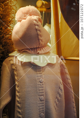 Mannequin with ideas for autumnal girl's dress and dry leaves in background Mannequin with ideas for autumnal girl's dress and dry leaves in background 107122872