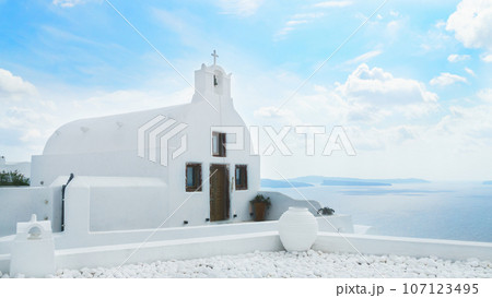 White church. Traditional architecture on Santorini island, Greece. Beautiful summer landscape. White church. Traditional architecture on Santorini island, Greece. Beautiful summer landscape. 107123495