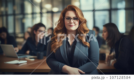Beautiful business woman in the office, happy and smiling business woman . High quality photo 107128584