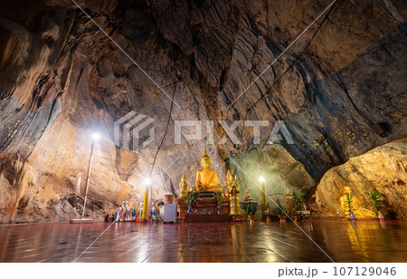Beautiful cave in Wat Tham Pha Chom temple a popular meditation spot for monks and Buddhist peoples located at Mae Sai district of Chiang Rai province. Beautiful cave in Wat Tham Pha Chom temple a popular meditation spot for monks and Buddhist peoples located at Mae Sai district of Chiang Rai province. 107129046