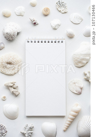 Blank notebook surrounded sea shells. Summer memories concepts. Blank notebook surrounded sea shells. Summer memories concepts. 107130466