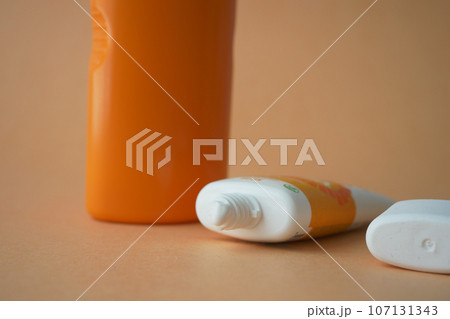 Close up of sunscreen cream in a pink container Close up of sunscreen cream in a pink container 107131343