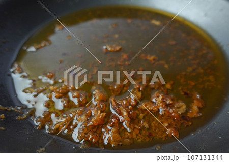 Used vegetable oil in a plate . 107131344