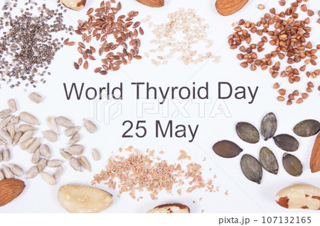 Inscription World Thyroid Day 25 May and best ingredients for healthy thyroid. White background 107132165