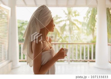 Perfect Morning of Woman With a Cup of Coffee After Shower on Terrace 107133833