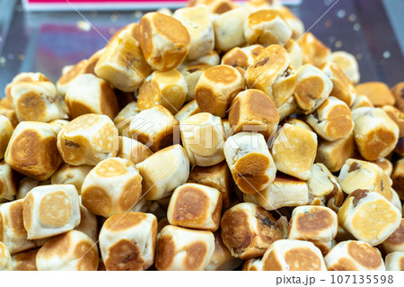 Dice Bean Cake snacks were placed on a stainless steel plate. Dice Bean Cake snacks were placed on a stainless steel plate. 107135598
