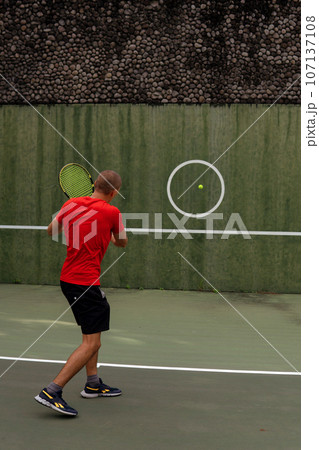 man playing tennis 107137108