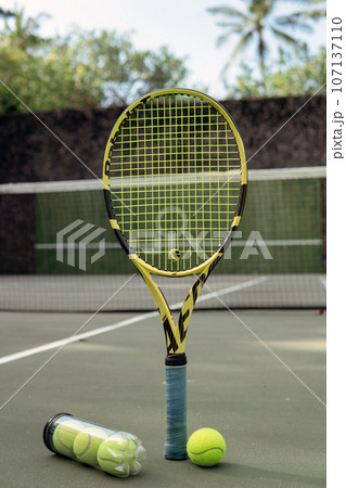 close-up. male hands holding tennis racket and balls close-up. male hands holding tennis racket and balls 107137110