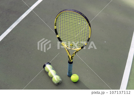 close-up. male hands holding tennis racket and balls 107137112