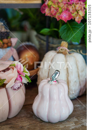 Decorative autumn pink artificial pumpkins and flowers in the store. Autumn, fall, harvest, Thanksgiving Decorative autumn pink artificial pumpkins and flowers in the store. Autumn, fall, harvest, Thanksgiving 107138305
