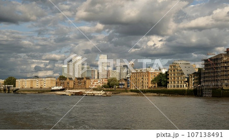 A sightseeing boat goes near the Tower Bridge. London 107138491