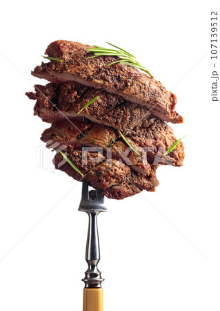 Grilled beef steak with rosemary isolated on a white background. 107139512