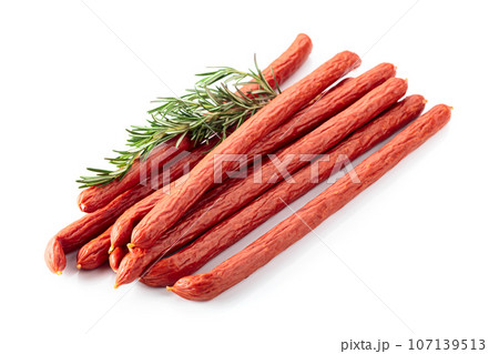 Smocked sausages with rosemary isolated on white. 107139513