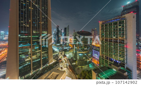 Dubai international financial center skyscrapers aerial all night. 107142902