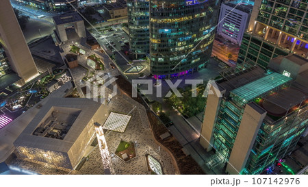 Dubai international financial center skyscrapers aerial day to night. 107142976