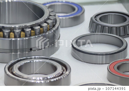 The cylindrical rolling bearing parts in light blue scene. The cylindrical rolling bearing parts in light blue scene. 107144391