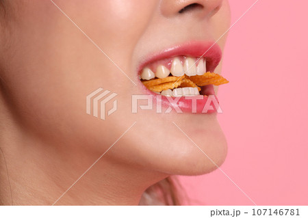 Eating Potato Chips Eating Potato Chips 107146781