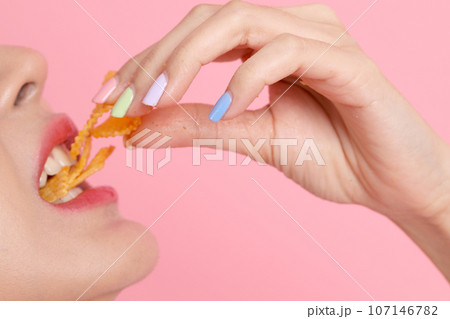Eating Potato Chips Eating Potato Chips 107146782
