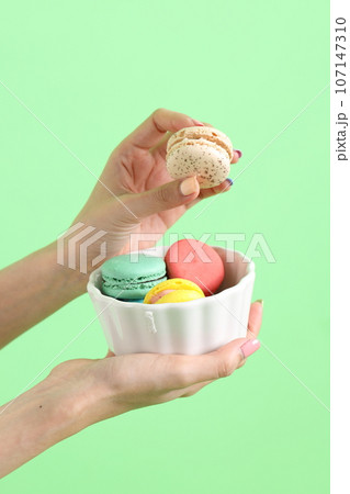 Hand with Macaroons 107147310