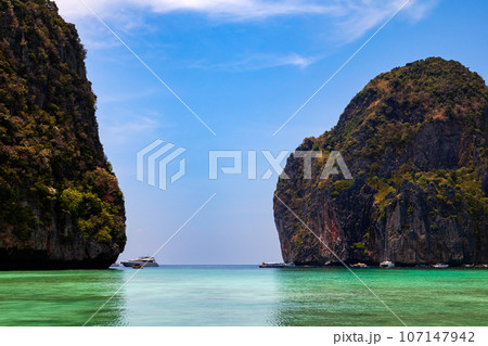 The legendary Maya Bay beach without people where the film "beach" with Leonardo DiCaprio was filmed with a beautiful bay of sand and clear turquoise water. UNESCO World Heritage. 107147942