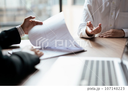 Male candidate job interviewing and answering question about cv and job experience with HR manager Male candidate job interviewing and answering question about cv and job experience with HR manager 107148223