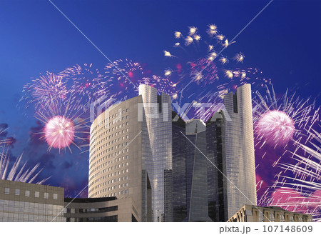 Celebratory fireworks over the Skyscrapers La Defense, commercial and business center of Paris, France 107148609