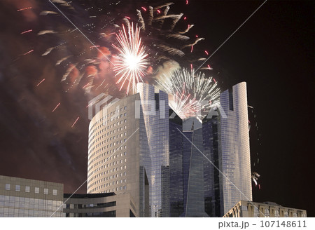Celebratory fireworks over the Skyscrapers La Defense, commercial and business center of Paris, France Celebratory fireworks over the Skyscrapers La Defense, commercial and business center of Paris, France 107148611
