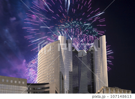 Celebratory fireworks over the Skyscrapers La Defense, commercial and business center of Paris, France Celebratory fireworks over the Skyscrapers La Defense, commercial and business center of Paris, France 107148613