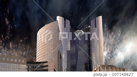 Celebratory fireworks over the Skyscrapers La Defense, commercial and business center of Paris, France Celebratory fireworks over the Skyscrapers La Defense, commercial and business center of Paris, France 107148627
