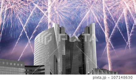 Celebratory fireworks over the Skyscrapers La Defense, commercial and business center of Paris, France 107148630