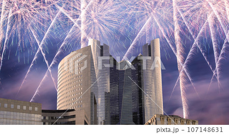 Celebratory fireworks over the Skyscrapers La Defense, commercial and business center of Paris, France 107148631