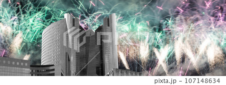Celebratory fireworks over the Skyscrapers La Defense, commercial and business center of Paris, France 107148634