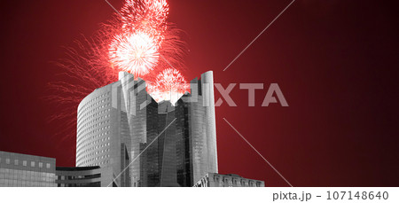 Celebratory fireworks over the Skyscrapers La Defense, commercial and business center of Paris, France 107148640