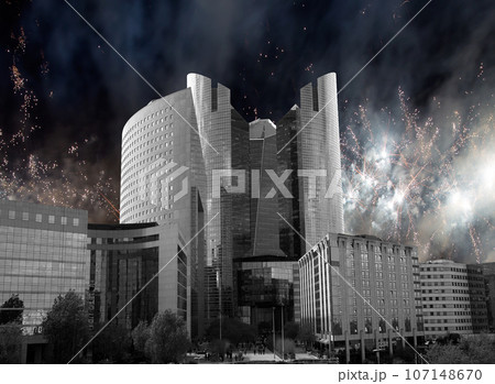 Celebratory fireworks over the Skyscrapers La Defense, commercial and business center of Paris, France 107148670