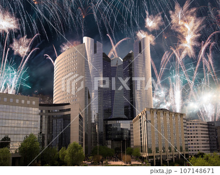 Celebratory fireworks over the Skyscrapers La Defense, commercial and business center of Paris, France Celebratory fireworks over the Skyscrapers La Defense, commercial and business center of Paris, France 107148671