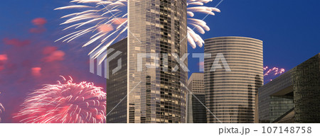 Celebratory fireworks over the Skyscrapers La Defense, commercial and business center of Paris, France 107148758